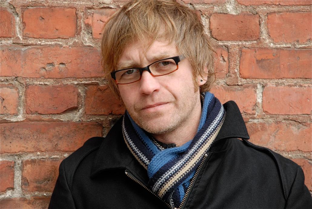 Nils Aulike liest am 1. Dezember im Café Godot aus „Jürnjakob Swehn der Amerikafahrer" von Johannes Gillhoff